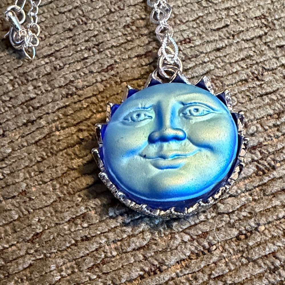 Blue and Silver Sun Face Pendant Necklace New 18 inch chain.